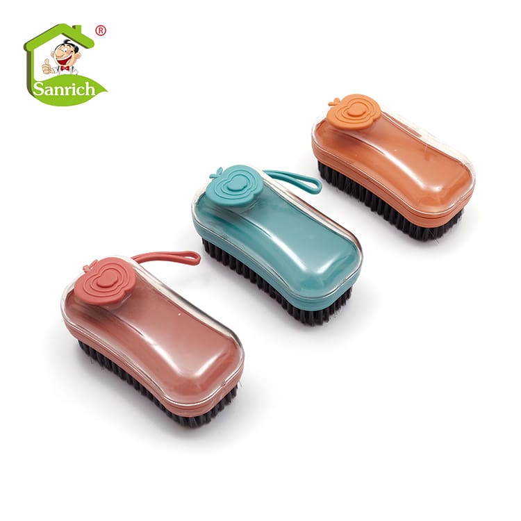 Three colorful silicone hot water bottles with covers and handles.