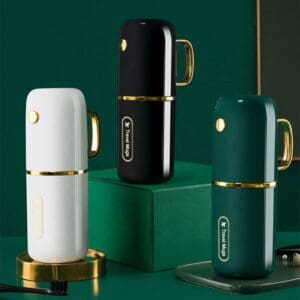 Three elegant modern humidifiers in white, black, and green with gold accents.