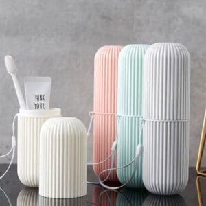 Modern pastel-colored toothbrush holders with a minimalist design.